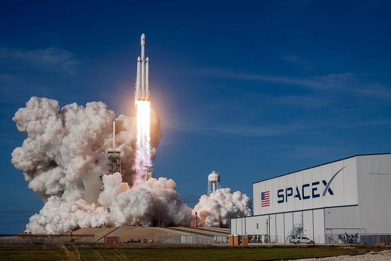 SpaceX logo against a backdrop of stars