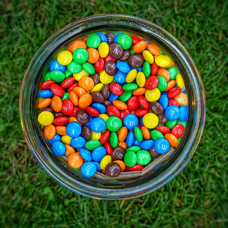 A jar filled with colorful candies