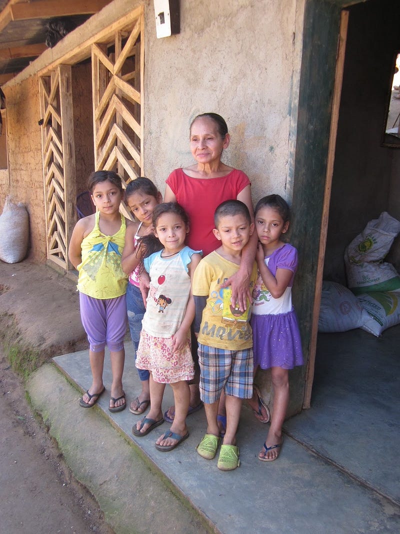 Doña Cyrila with her grandchildren affected by landslides