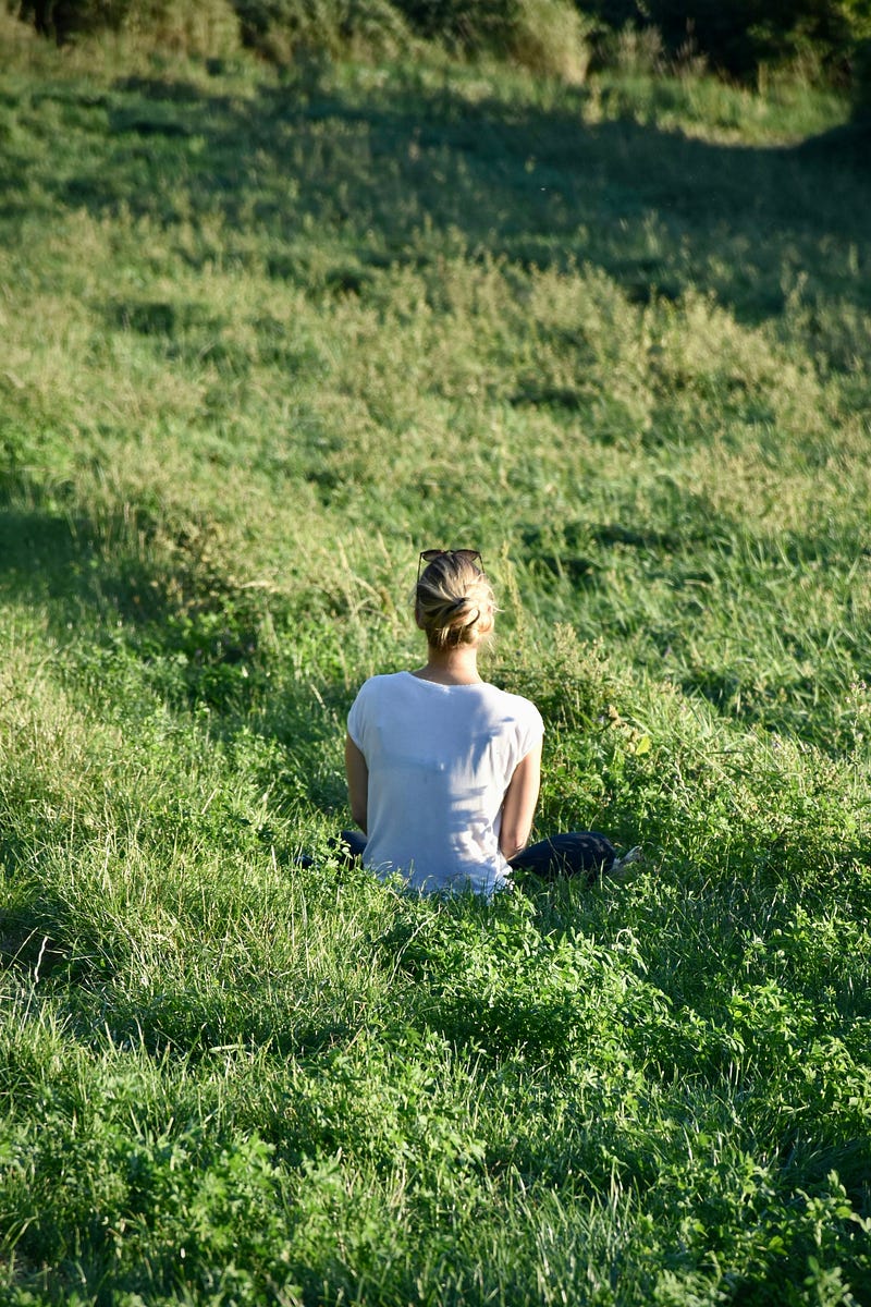 Woman practicing yoga, embodying daily consistency