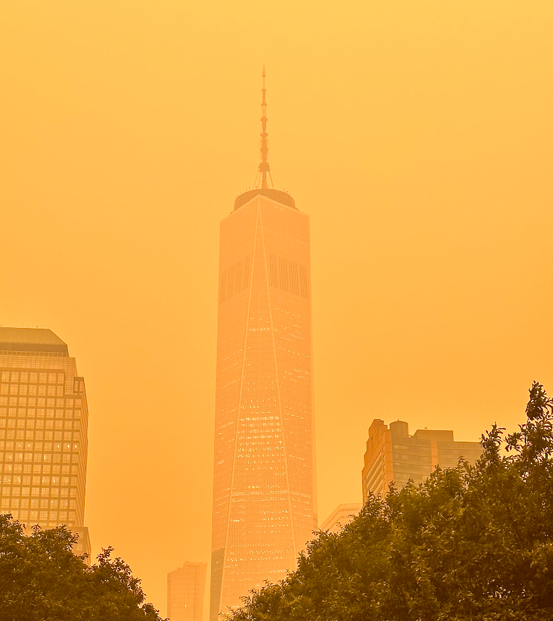 The Freedom Tower surrounded by smoke