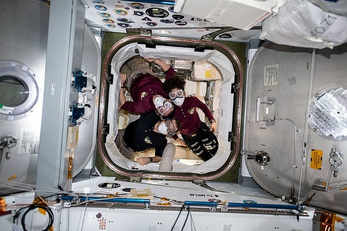 Astronauts inside a SpaceX Dragon capsule