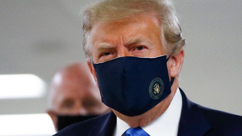 President Trump wearing a mask during a hospital visit